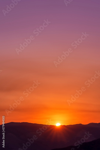 Orange Sunset over Horizon, mountains, silhouette 