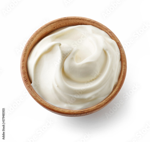 Foto wooden bowl of whipped yogurt cream