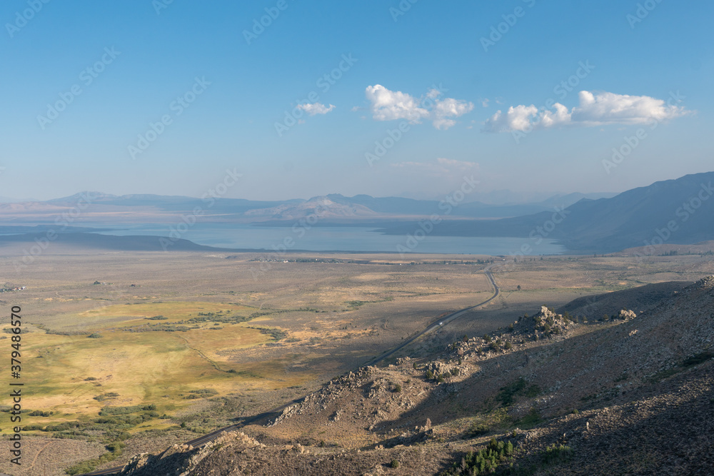 Fototapeta premium The San Luis Reservoir during dry and hot season, artificial lake on San Luis Creek in the eastern slopes of the Diablo Range of Merced County, California. USA
