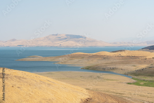 The San Luis Reservoir during dry and hot season  artificial lake on San Luis Creek in the eastern slopes of the Diablo Range of Merced County  California. USA