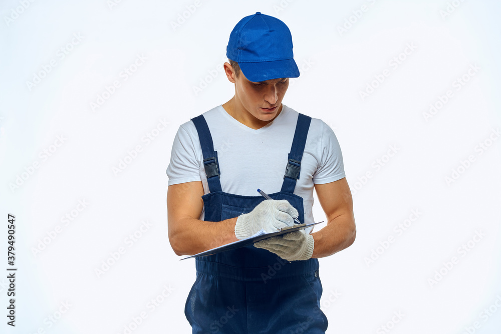 Man worker with box in hands delivery loading service work light background Man worker with box in hands delivery loading service work light background