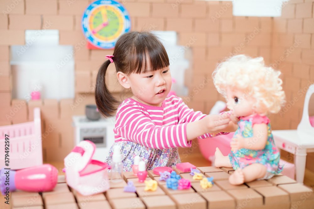young girl pretend play babysitting with baby doll at home young girl pretend play babysitting with baby doll at home