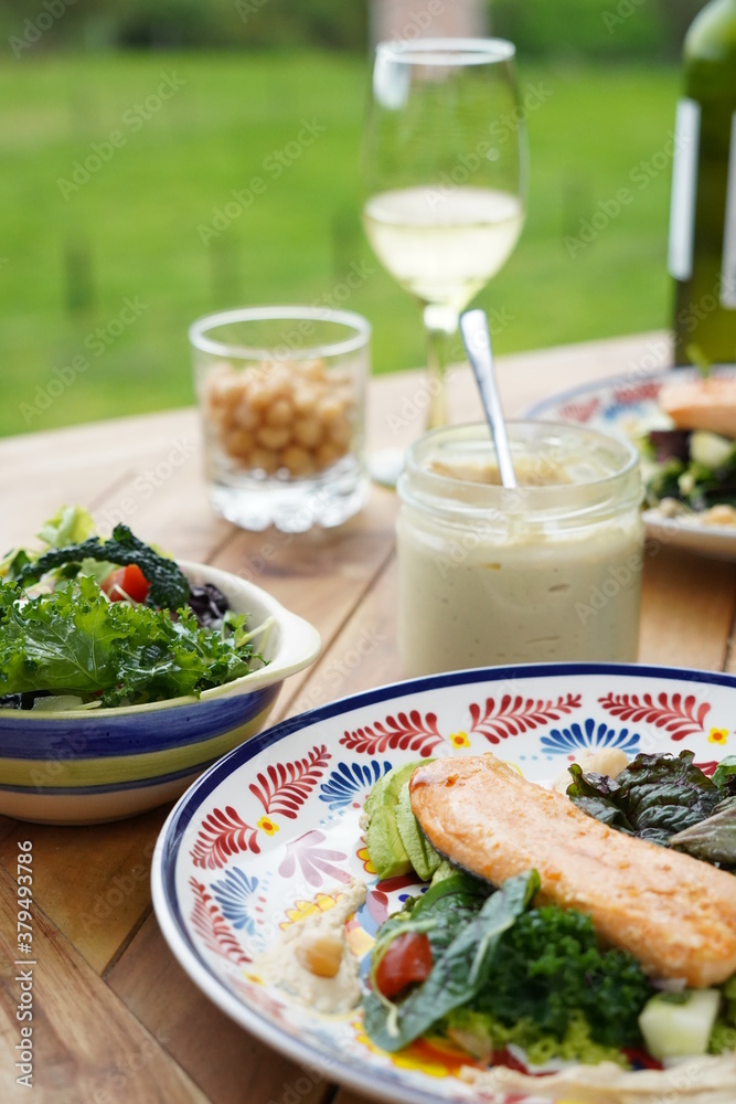 salmon salad healthy lunch outdoors
