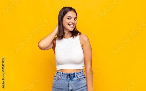 Картината върху платно young pretty woman laughing cheerfully and confidently with a casual, happy, fri
