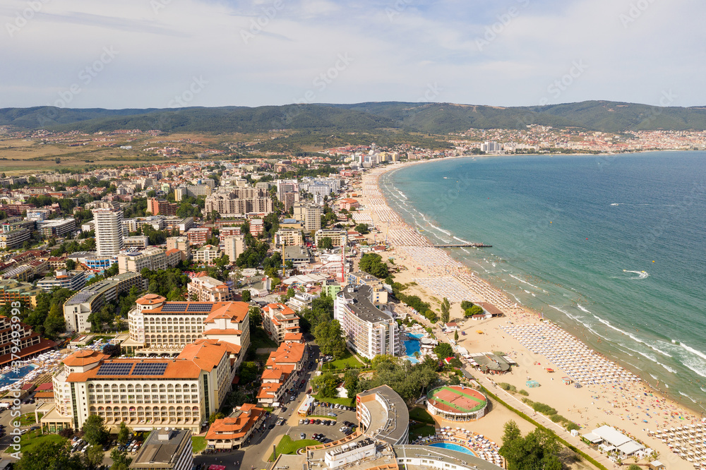 Suny Beach, Bulgaria - August 09, 2019: Aerial image drone resort in Bulgaria on Black Sea coast. Many hotels and beaches with tourists, sunbeds and umbrellas. Sea travel destination