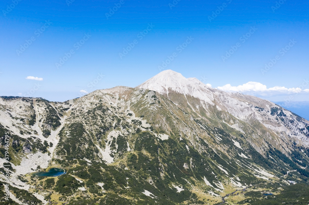Aerial view from the drone. A stunning view of the mountain peaks in Bulgaria, shot from a drone in the morning at dawn. Travel and vacation concept.