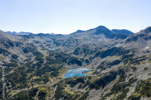 Aerial view from the drone. A stunning view of the mountain peaks in Bulgaria, shot from a drone in the morning at dawn. Travel and vacation concept.