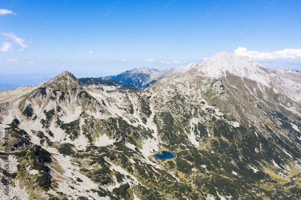 Aerial view from the drone. Stunning view of the mountain peaks in Bulgaria, shot from a drone in morning at dawn. Travel and vacation concept.