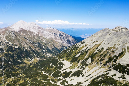 Wallpaper Mural Aerial view from the drone. A stunning view of the mountain peaks in Bulgaria, shot from a drone in the morning at dawn. Travel and vacation concept. Torontodigital.ca