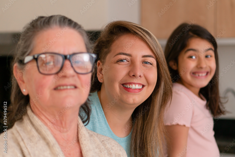 Portrait of brazilian family of women with big smile looking at camera at kitchen table, inside. Happiness, affection, love, care concept.. Portrait of brazilian family of women with big smile looking at camera at kitchen table, inside. Happiness, affection, love, care concept..