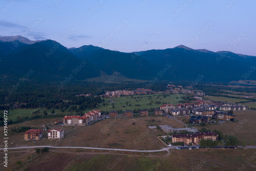 Aerial view from the drone. Stunning mountain and countryside view shot from a drone in the morning at dawn. Beautiful landscape of sunrise in the mountains