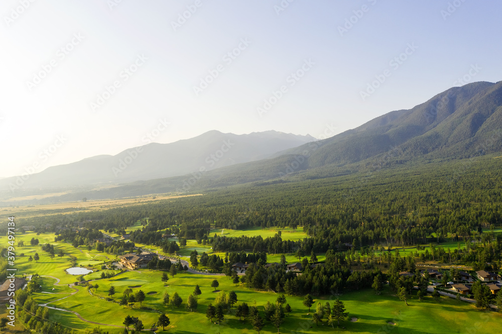 Aerial view from the drone. Stunning mountain and countryside view shot from a drone in the morning at dawn. Beautiful landscape of sunrise, the mountains in the haze Aerial view from the drone. Stunning mountain and countryside view shot from a drone in the morning at dawn. Beautiful landscape of sunrise, the mountains in the haze