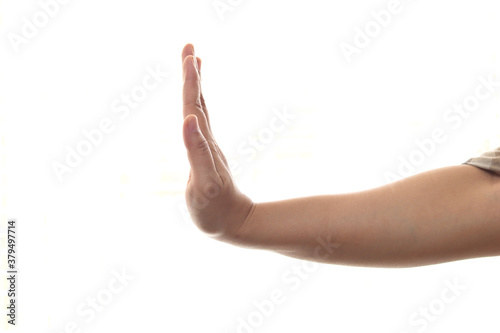Side view of female hand showing stop gesture, isolated on white background