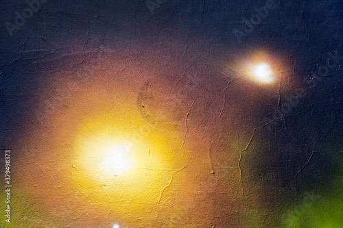 Abstract creative background of chaotic strokes of old cracked paint on concrete wall. Old surface with traces of paint, weathered, scratches and cracks for design