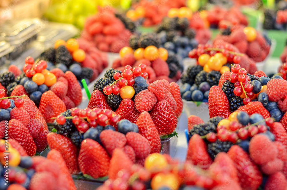 Fresh strawberry, blueberry, blackberry on the market counter. Selective focus. Fresh strawberry, blueberry, blackberry on the market counter. Selective focus.
