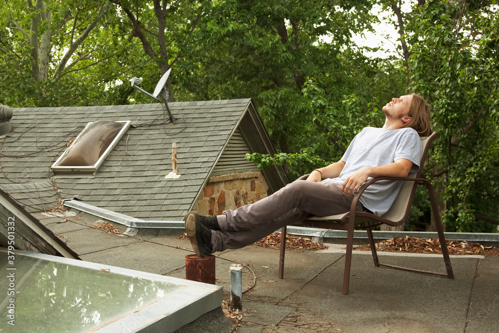 Man relaxing on roof Man relaxing on roof