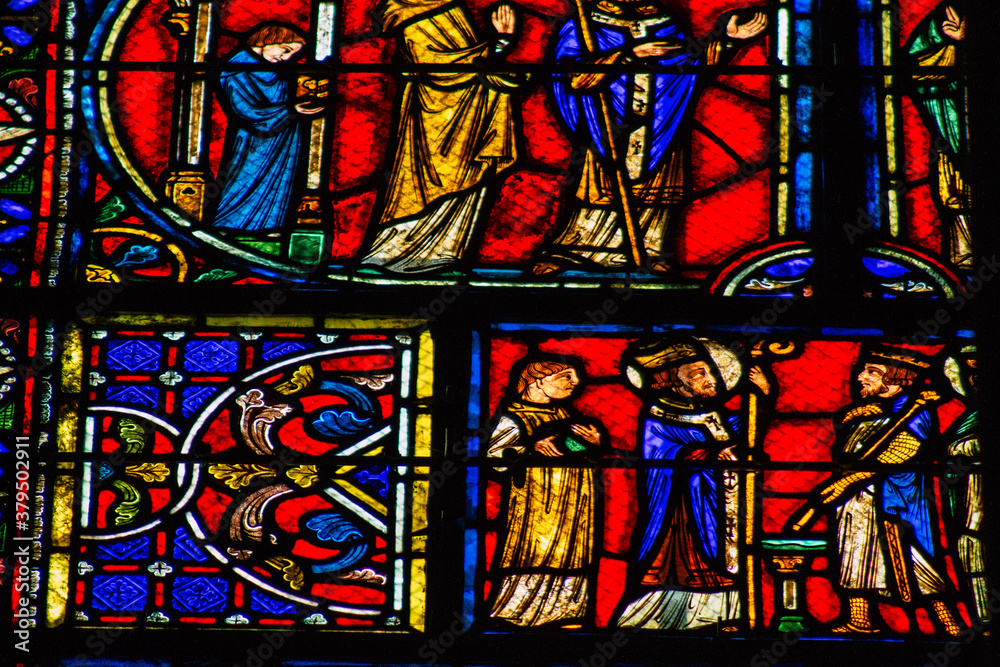 View of stained glass windows inside the Basilica of Saint-Remi, a medieval abbey church in Reims, a historical monument in the Grand Est region of France  
