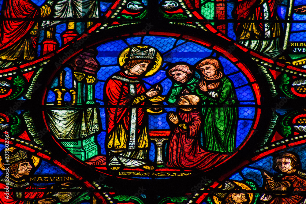 View of stained glass windows inside the Basilica of Saint-Remi, a medieval abbey church in Reims, a historical monument in the Grand Est region of France  
