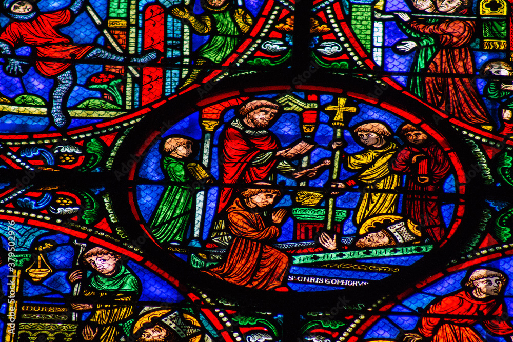 View of stained glass windows inside the Basilica of Saint-Remi, a medieval abbey church in Reims, a historical monument in the Grand Est region of France  
