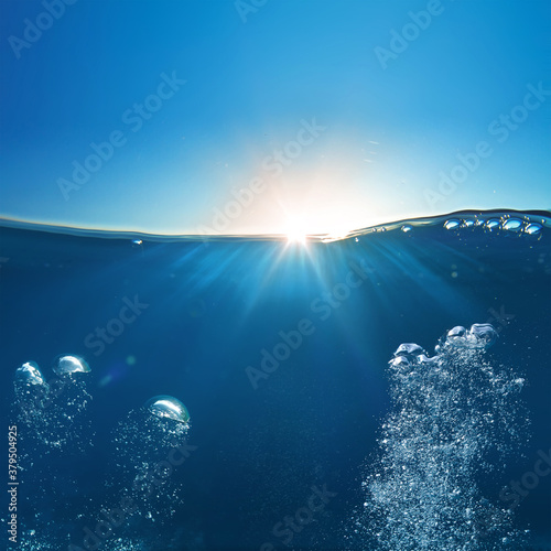 Sky and Sea Water divided by waterline. Ocean aquatic nature design. Tropical shining waters