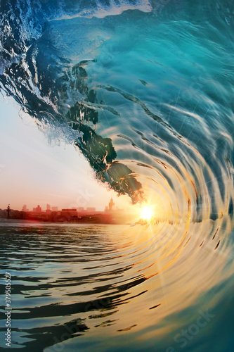 Beautiful ocean surfing shorebreak wave at sunset time