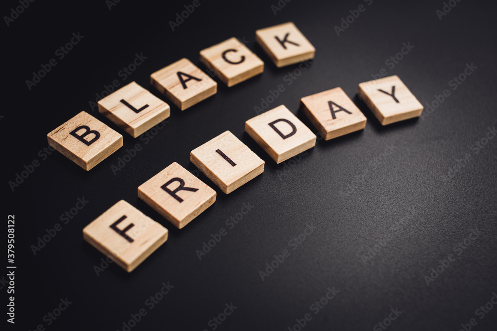 Obraz premium friday november wooden text on black background