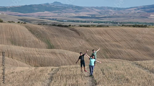 Wallpaper Mural Val d'Orcia, Siena, Tuscany, Italy. August 2020. The new normal after the coronavirus by visiting these amazing places: a mother with her children have their masks in their hands and enjoy nature. Torontodigital.ca