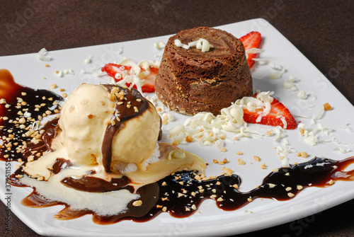 Petit gateau is a dessert made up of a small chocolate cake and creamy filling served with ice cream.