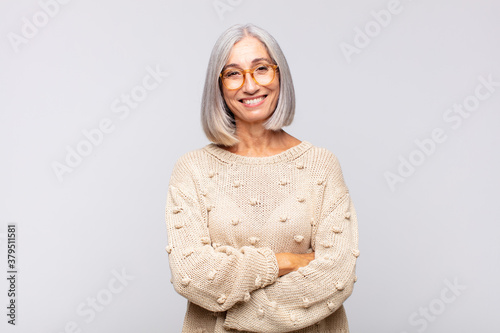 фотографія gray haired woman looking like a happy, proud and satisfied achiever smiling wit