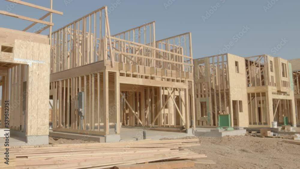 Very Slow Tilt on Framing Work on New Home Construction - Shallow Depth of Field Very Slow Tilt on Framing Work on New Home Construction - Shallow Depth of Field