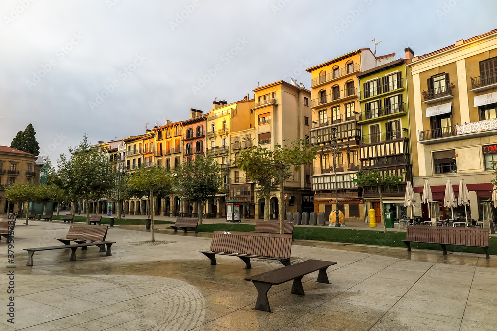 Naklejka premium Dawn in the Castle square, with sunlight on the buildings, Pamplona municipality, capital of the province of Navarra, Spain