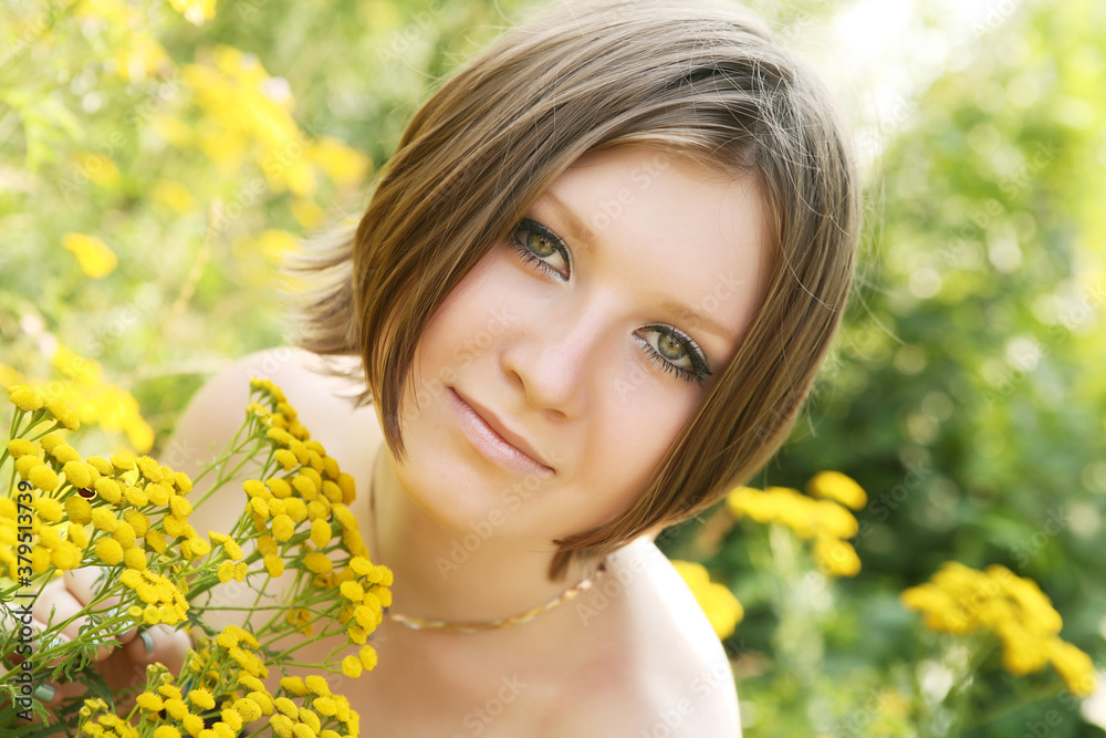 young woman and wild flowers. young woman and wild flowers.