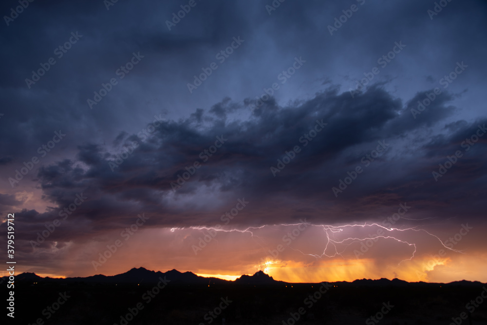 Lightning at sunset during a monsoon storm