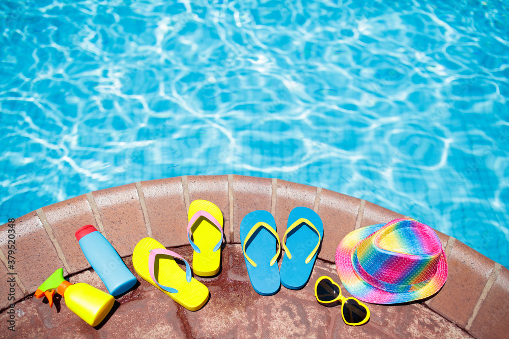 Naklejka premium Pool and beach items flat lay. Summer vacation.