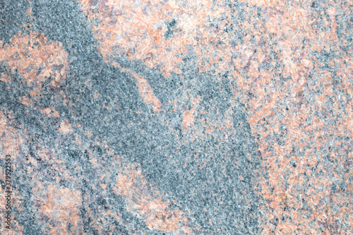Gray stone with pink streaks. Smooth marble surface. Beautiful patterns and lines. © Julija