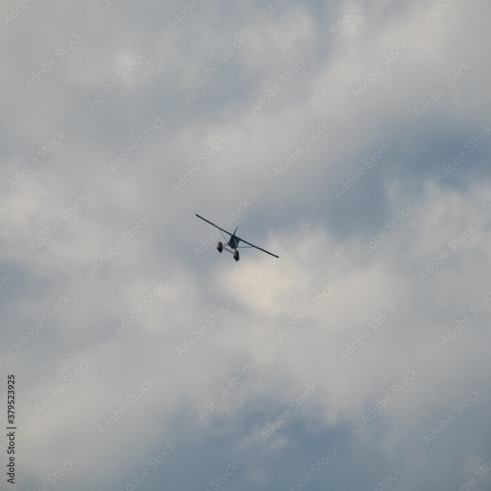 Sea plane flying high above Sydney Harbour Australia