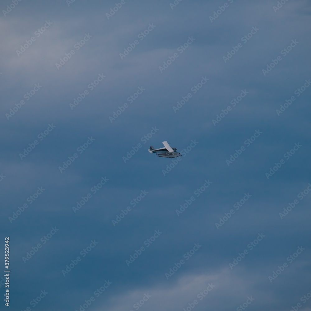 Fototapeta premium Sea plane flying high above Sydney Harbour Australia