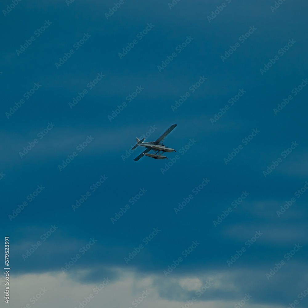 Sea plane flying high above Sydney Harbour Australia Sea plane flying high above Sydney Harbour Australia