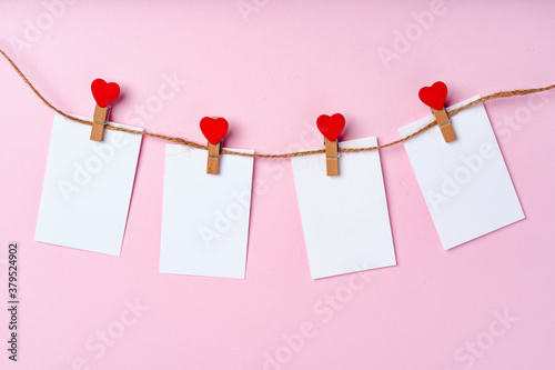 Heart clothespins on rope. Creative background with copy space