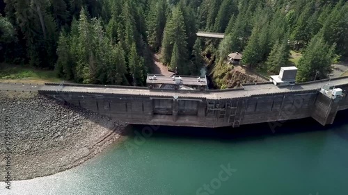 Flying Towards The Wynoochee Dam With A Calm Lake And Lush Green Coniferous Trees In The Mountains In The North Of Montesano, Washington State, USA.  - aerial descending shot photo