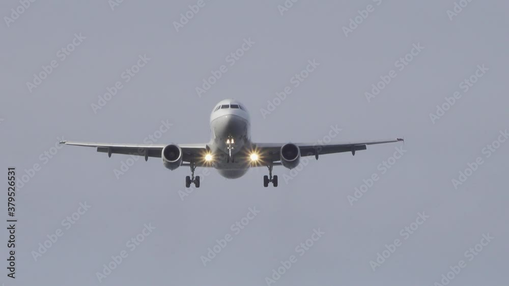 Commercial passenger airplane jet on final approach coming in for landing at the airport. Commercial passenger airplane jet on final approach coming in for landing at the airport.
