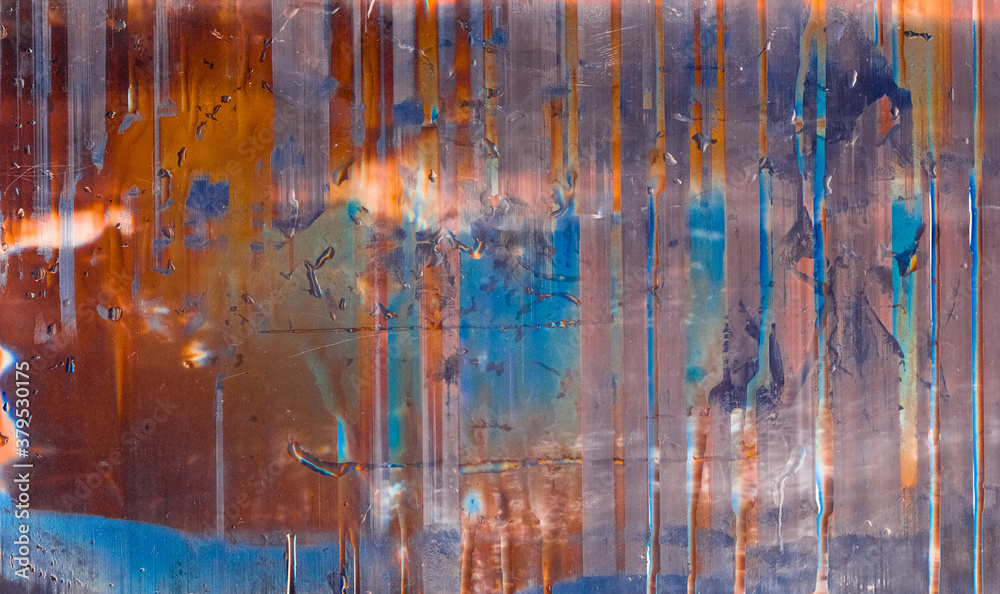 Wet grunge background. Paint drip texture. Rusty orange purple blue screen defect with water drops.
