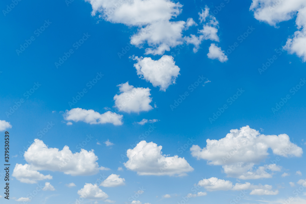 Blue clear sky with white fluffy clouds. Natural background Blue clear sky with white fluffy clouds. Natural background