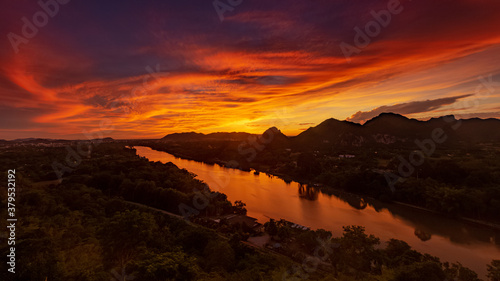 Kanchanaburi city and  with River Kwai noi in the sunrise. View point from the Wat Tham Kaophoon. Kanchanaburi province-Thailand.
