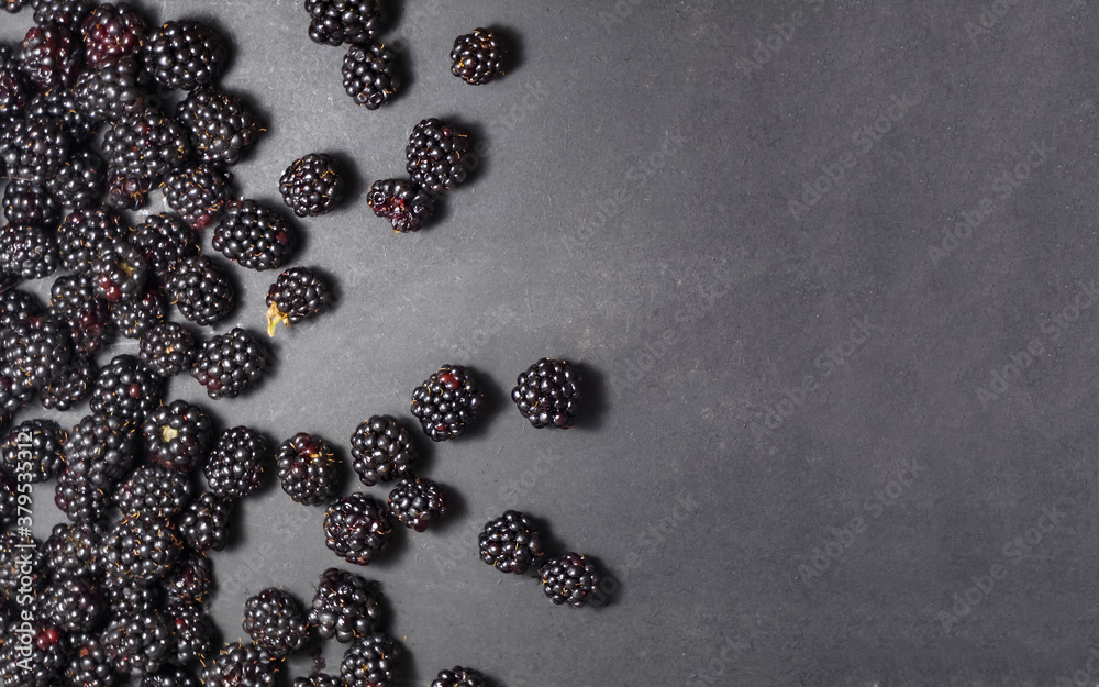 Fresh ripe blackberries on a black background. Fresh ripe blackberries on a black background.