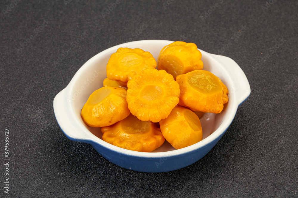 Marinated yellow patisson in the bowl