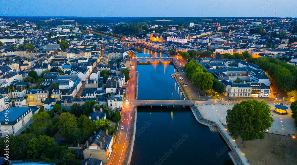 Evening aerial view of the city of Laval and the Mayenne river. France