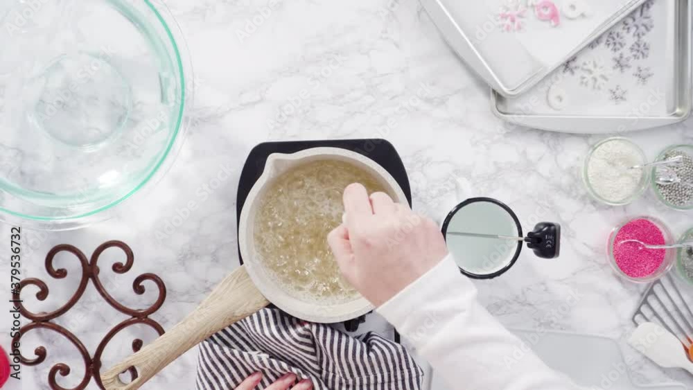 Flat lay. Step by step. Caramelizing sugar in a small cooking pot over ...
