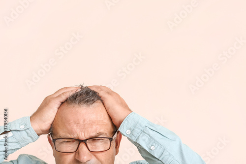 Stressed mature man on colo...