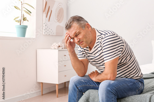 Stressed mature man at home